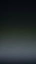 Dark Gray and Green Gradient Abstract Background with Subtle Light Diffusion and Soft Blurring Effect Creating a Moody and Royalty Free Stock Photo