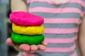 Colorful play dough on hand
