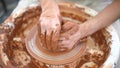 Creating vase of white clay close-up. The sculptor in the workshop makes a jug out of earthenware closeup. Twisted