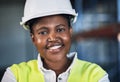 Creating the world the way you envision it to be. Portrait of a confident young woman working a construction site. Royalty Free Stock Photo