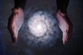 Creationism concept. Hands of God are creating Galaxy in universe. Royalty Free Stock Photo