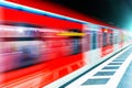 Subway metro train at railway station platform with motion blur Royalty Free Stock Photo