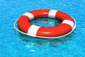Lifesaver belt in the blue water Royalty Free Stock Photo