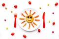 Creative approach to kid`s braekfast. Meal with cheesecake in shape of sun. White background top view Royalty Free Stock Photo