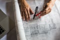 Creative architect projecting on the big drawings in the dark lo Royalty Free Stock Photo