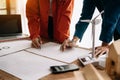 Creative architect projecting on the big drawings in the dark loft office Royalty Free Stock Photo