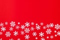 Creative arrangement of christmas decoration snowflakes on red background. Holiday concept. Flat lay, top view Royalty Free Stock Photo