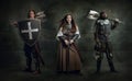 Creative art collage with brutal serious medieval warriors or knights with wounded faces holding shield, sword isolated Royalty Free Stock Photo