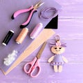 Creative art and craft idea for kids. Felt doll keychain, scissors, thread, needles, pins, suede cord, pliers, felt sheets Royalty Free Stock Photo