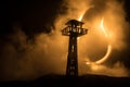 Creative artwork decoration. Silhouette of army watchtower at night. Selective focus Royalty Free Stock Photo