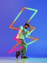 Creative artwork of prfessional male hip-hop dancer in motion over neon lightning element over blue background