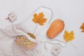 Creative autumn composition with pumpkins yellow leaves