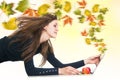 Creative autumn maple leaves wind from laptop