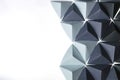 Creative background assembled with black and gray origami tetrahedrons Royalty Free Stock Photo