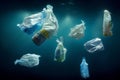 creative background of garbage in disposable plastic bags floating in the sea or ocean under water. Royalty Free Stock Photo