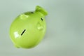 Creative background, green pig money box on gray background top view, flat lay. The concept of saving money, savings, pig piggy, Royalty Free Stock Photo