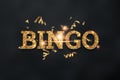 Creative background, the inscription bingo in gold letters on a dark background. Concept win, casino, idea, luck, lotto. 3D Royalty Free Stock Photo