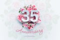 Creative background lettering 35 numbers and anniversary celebration text on pink flowers background. Anniversary concept,