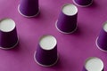 Creative background with Lilac paper cups for coffee