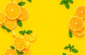 Creative background made of summer fruits with mint leaves, grapefruit, orange, lemon on bright yellow background. Many different Royalty Free Stock Photo