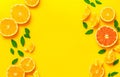 Creative background made of summer fruits with mint leaves, grapefruit, orange, lemon on bright yellow background. Many different Royalty Free Stock Photo