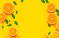 Creative background made of summer fruits with mint leaves, grapefruit, orange, lemon on bright yellow background. Many different Royalty Free Stock Photo