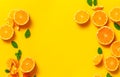 Creative background made of summer fruits with mint leaves, grapefruit, orange, lemon on bright yellow background. Many different Royalty Free Stock Photo