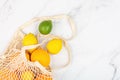 Creative background made of summer tropical fruits with grapefruit, orange, tangerine, lemon, lime on white marble background.