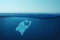 Creative background, plastic bag floating in the ocean, bag in the water. Concept of environmental pollution, non-decomposable Royalty Free Stock Photo