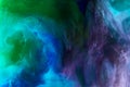 creative background with purple, blue and green watercolor paint in water as space Royalty Free Stock Photo