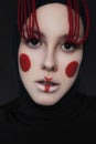 Creative beauty with geometric make up on a woman. red stripe on