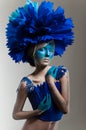 Creative beauty shot with cyan headdress