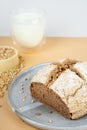 creative beige background with green buckwheat bread and organic buckwheat milk. Harmless, wellness, gluten free healthy baking.