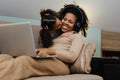 Creative black mother and daughter working on school project, using modern laptop