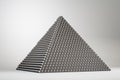 Creative black pyramid on grey background