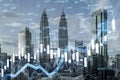 Creative candlestick forex chart and growing arrow on blurry city backdrop. Trade, finance and stock concept. Double exposure Royalty Free Stock Photo