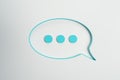 Creative blue speech bubble on light background. Conversation and sms concept. Royalty Free Stock Photo