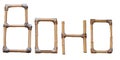 Creative BOHO lettering made from bamboo sticks held together with rough ropes, isolated on white, boho style Royalty Free Stock Photo