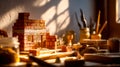Creative brick structure built on a worktable with rustic tools and materials in warm sunlight Royalty Free Stock Photo