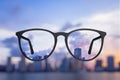 Creative bright city view through eyeglasses Royalty Free Stock Photo