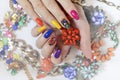 Creative bright saturated manicure on long nails with rhinestones.