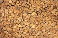 Creative Brown Background Of Neatly Stacked Firewood. Brown Texture Of Natural Wood.