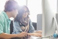 Creative business colleagues using desktop computer in office Royalty Free Stock Photo