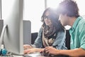 Creative business colleagues using desktop computer in office Royalty Free Stock Photo