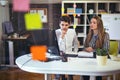 Creative business colleagues using desktop computer in office Royalty Free Stock Photo