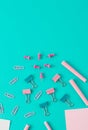 Creative business concept made of  colorful paper clips, chalks, pencil, papers. Blue background. Flat lay. Royalty Free Stock Photo
