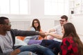 Creative business team put hands together in coworking office Royalty Free Stock Photo