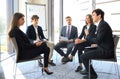 Creative business people meeting in circle of chairs. Royalty Free Stock Photo