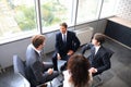 Creative business people meeting in circle of chairs. Royalty Free Stock Photo