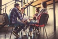 Creative business people meeting in circle of chairs. Royalty Free Stock Photo